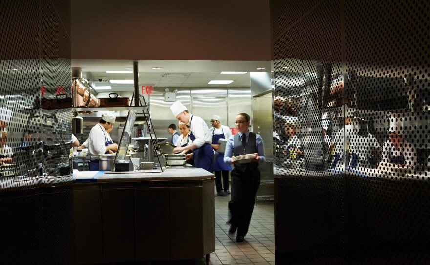 Staff in the kitchen of The Modern, a restaurant operated by Meyer's Union Square Hospitality Group and located in the Museum of Modern Art.
