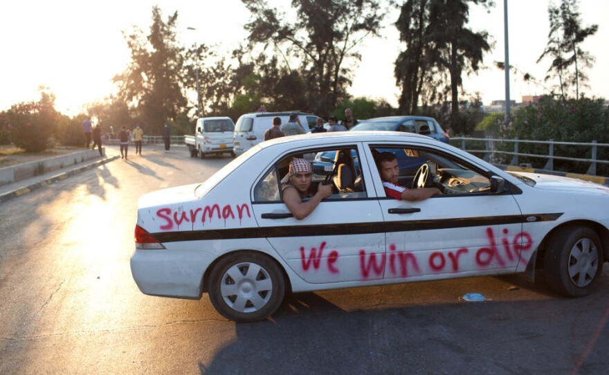 Libyan rebels drive Tripoli, where some clashes are continuing with pro-Gadhafi loyalist soldiers.
