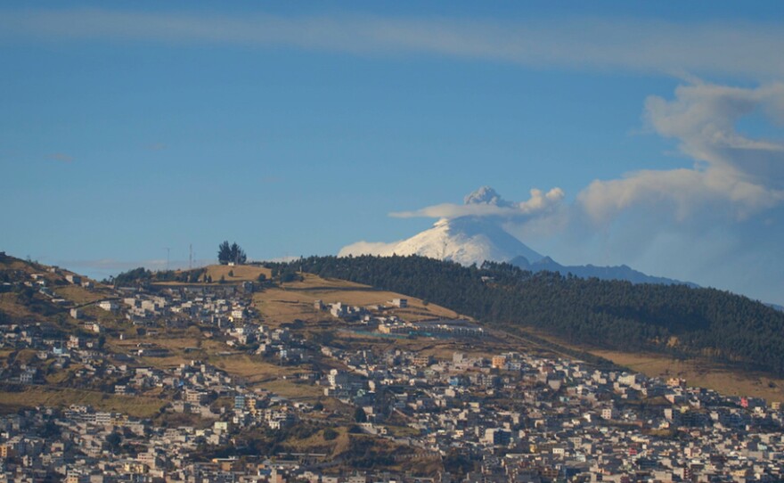 Cotopaxi Volcano in Ecuador, with the heavily populated community below.