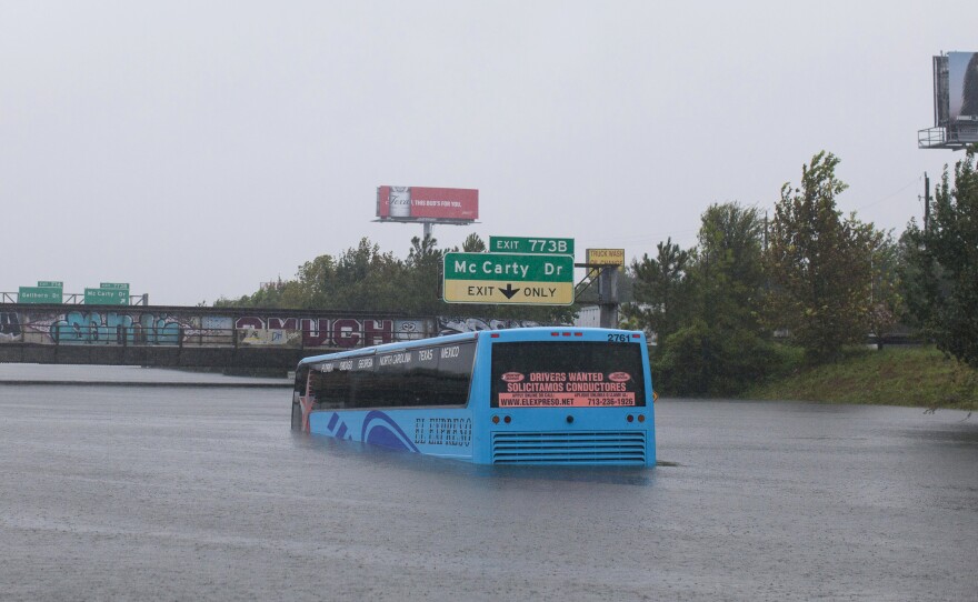 A bus is stuck in the flooded Interstate 10 in Houston on Monday. Hurricane Harvey, a Category 4 storm, made landfall on the Texas coast near Corpus Christi on Friday.