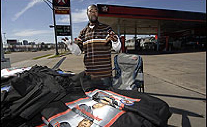 Moe Mac of Dallas sells Sen. Barack Obama T-shirts, while traveling the Obama Campaign route March 9, in Jackson, Miss.