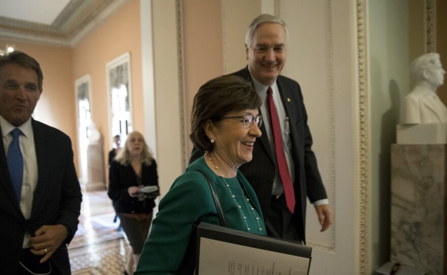 Sen. Susan Collins, a Republican from Maine, walks through the Capitol with colleagues in early December.