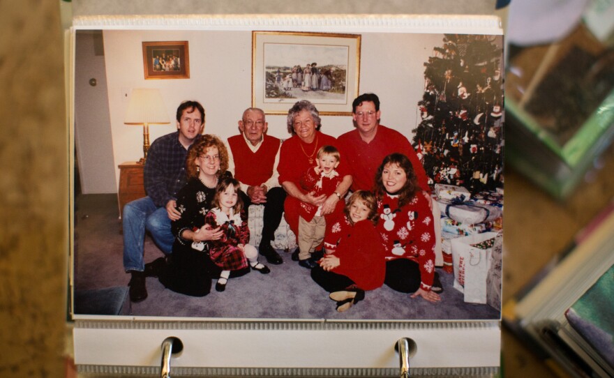 Helen and her late husband Raymond pose with the family in 1997. Christmas was a big event then, with matching outfits, stacks of presents and lots of food.