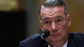 FILE - Todd Lyons, senior official performing the duties of the director at U.S. Immigration and Customs Enforcement, listens during a Senate Homeland Committee hearing on Capitol Hill in Washington, Feb. 12, 2026.