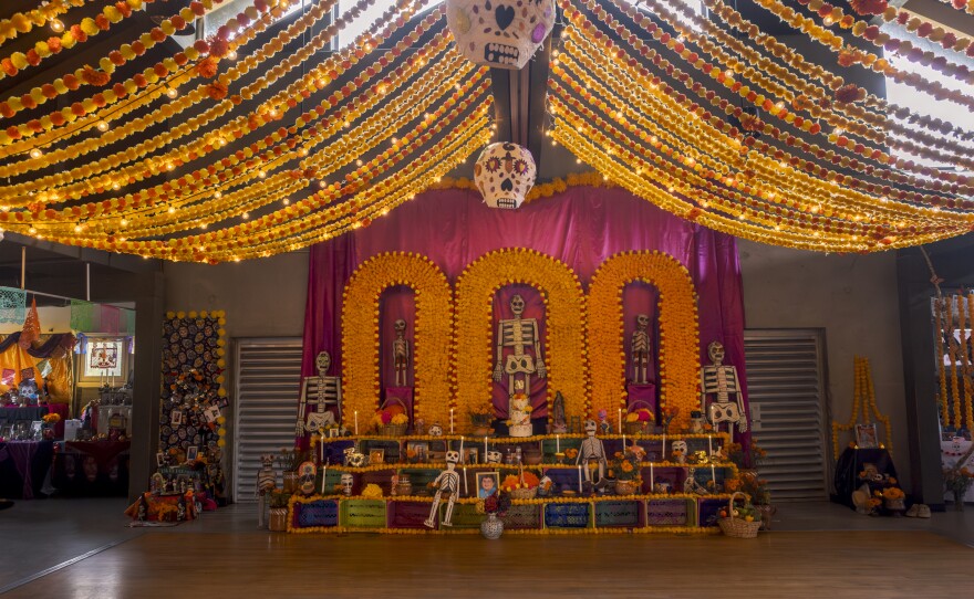 The community altar for Día de Muertos at the Sherman Heights Community Center offers people milk crate-sized spots to create their own mini-altar to honor loved ones who have passed on, Oct. 15, 2024.