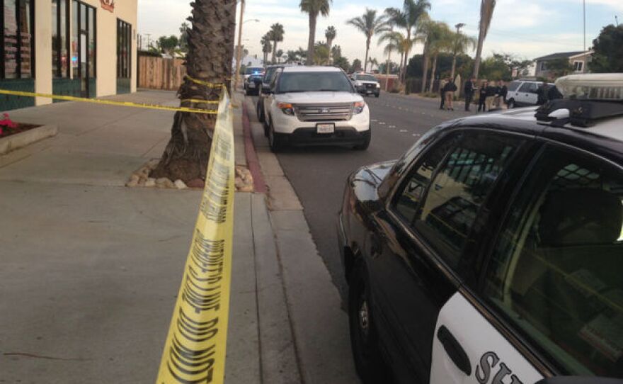 Authorities investigate after the remains of an infant were found in an Imperial Beach dumpster, Jan. 4, 2015.