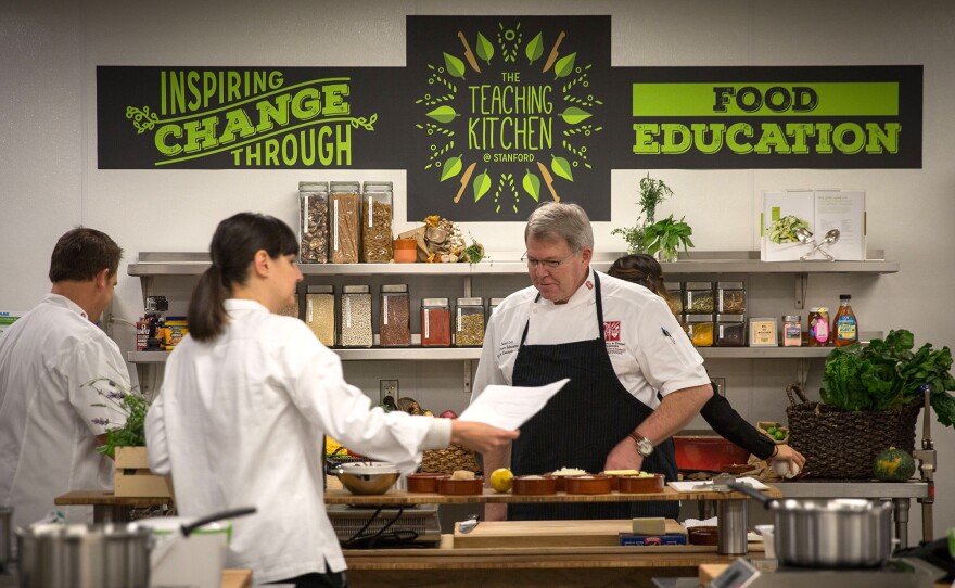 Stanford Teaching Kitchen's culinary team checks on ingredients for the program's various cooking classes.