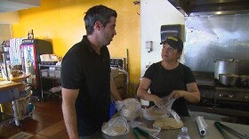 Juan Pablo Sanchez talks to one of his employees at Super Cocina in City Heights, June 24, 2016.