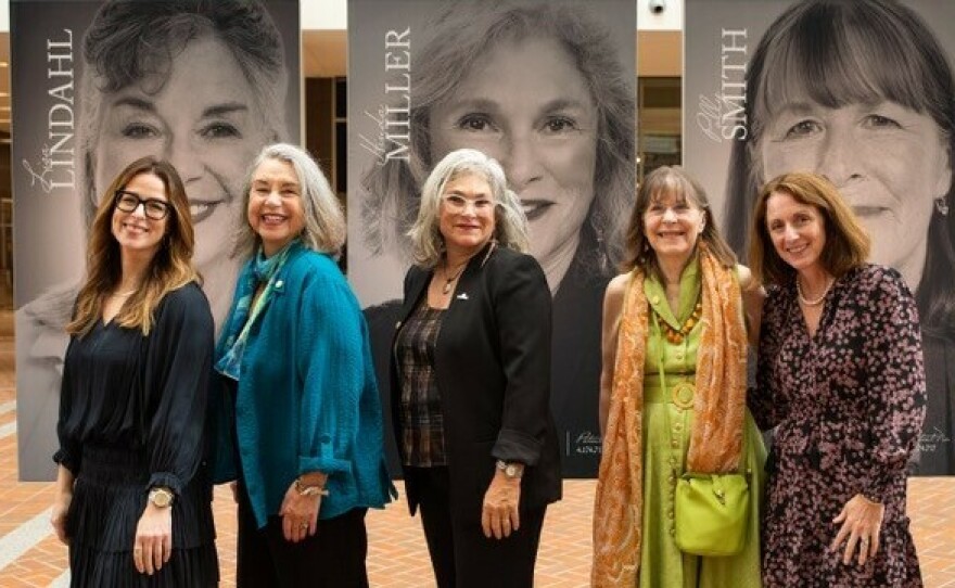 Sports bra inventors (middle three, from left to right) Lisa Lindahl, Hinda Miller and Polly Smith at the National Inventors Hall of Fame Museum, which featured a sports bra exhibit in October 2022.