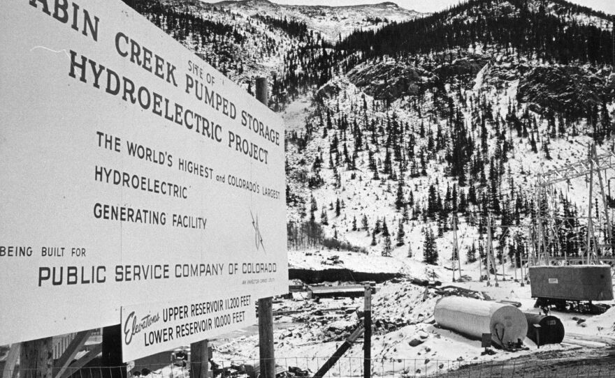 Sign at the upper reservoir construction area gives details of Public Service Company's Cabin Creek Pumped Storage project, a hydroelectric power installation at an elevation above 10,000 feet near Georgetown, Colorado on April 22, 1965.