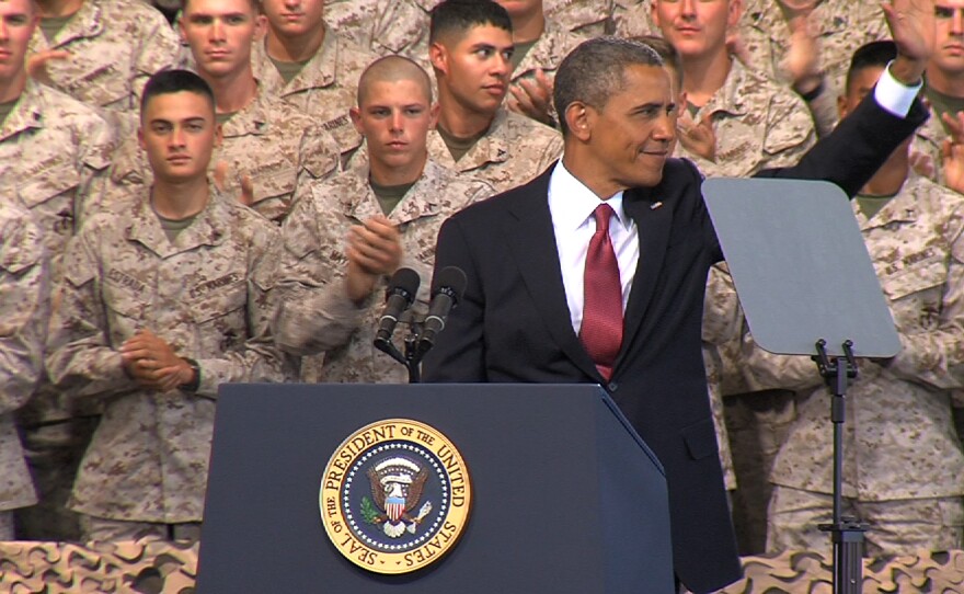 President Barack Obama waves to the troops and their familes after his speech at Marine Corps Base Camp Pendleton on Wednesday, August 7, 2013, during his first visit to the base.