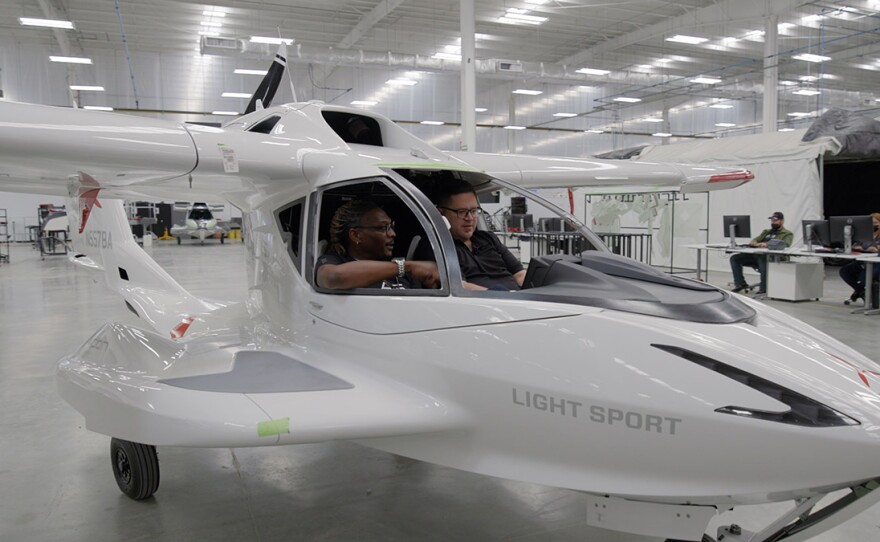 Host Jorge Meraz (right) checks out the amphibious airplanes at the Icon Aircraft factory in Tijuana with Kevin Golden (left)