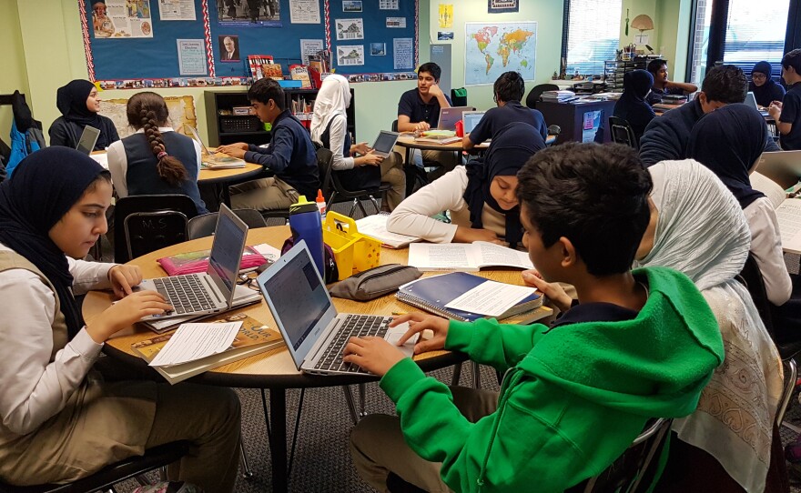 Eighth-graders write letters to local representatives about issues that concern them.
