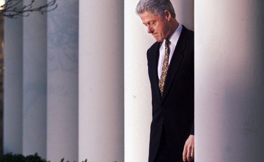 President Clinton walks to the White House Rose Garden to deliver a statement on the impeachment inquiry on Dec. 11, 1998.
