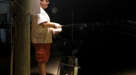 Bryan Casey does a bit of night fishing in an undisclosed location near Grand Isle, La.