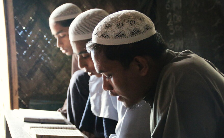 Rohingya students recite from the Quran at a madrassah, or Islamic school, outside Sittwe. About 70 percent of the students at the madrassah are internally displaced persons. Their options for education are limited, and Sittwe University stopped admitting Rohingya students after 2012.