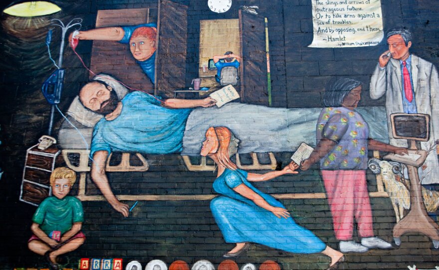 A detail of Regina Holliday's mural showing her husband, Fred, in his hospital bed receiving a blood transfusion.