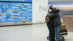 Abdullah Alghazali, right, hugs his 13-year-old son Ali Abdullah Alghazali after the Yemeni boy stepped out of an arrival entrance at John F. Kennedy International Airport in New York, Feb. 5, 2017. 