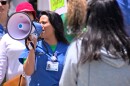 Radiologic technologist Melissa Macario speaks into a megaphone during a union picket at UC San Diego's Jacobs Medical Center on Wednesday, May 22, 2024.