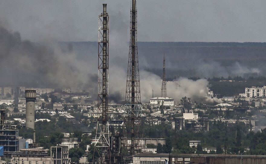 Black smoke and soot rise from the city of Sievierodonetsk, eastern Ukraine, during a battle between Russian and Ukrainian troops on Thursday. Ukraine's leader has called it the epicenter of the fight for the Donbas region.