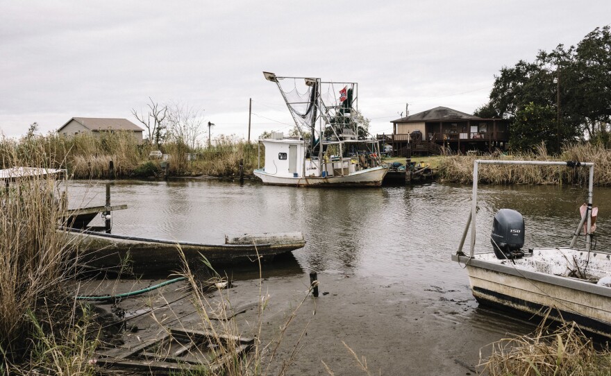 Fishing boats and storage sheds line Bayou Dularge in the tiny fishing village of Theriot.