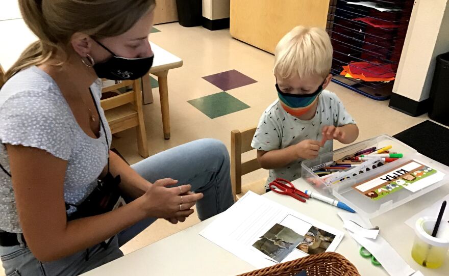 A teacher works at a San Diego preschool in this undated photo.