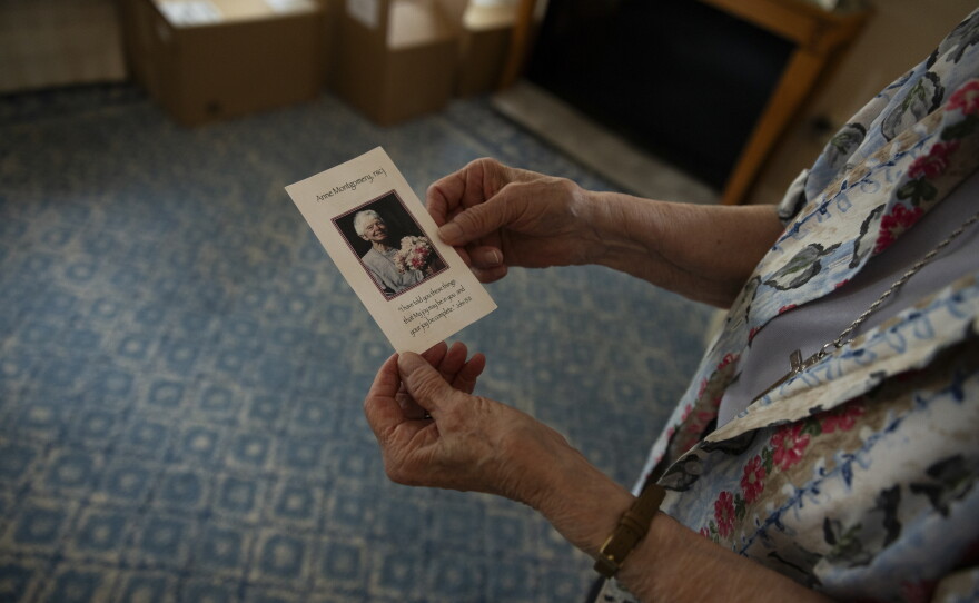 Sister Claire Pratt, 86, holds a photo of Anne Montgomery, the namesake of the community house in Washington, D.C., on July 31, 2026. The home was run by Society of the Sacred Heart, an international congregation of Roman Catholic women, and is closing after a decade.