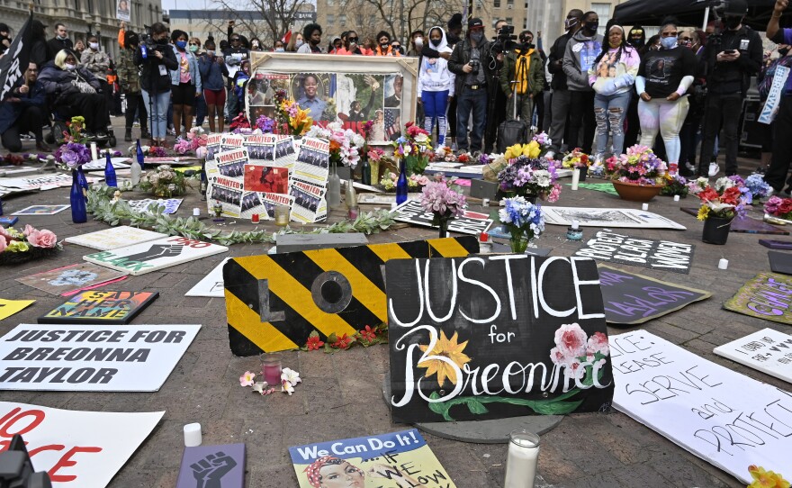 Protesters gathered at a memorial a Louisville, Ky. park on March 13, 2021, the anniversary of Breonna Taylor's killing. Jonathan Mattingly, one of the officers involved in the fatal raid, is facing widespread criticism for planning to publish a book about it.