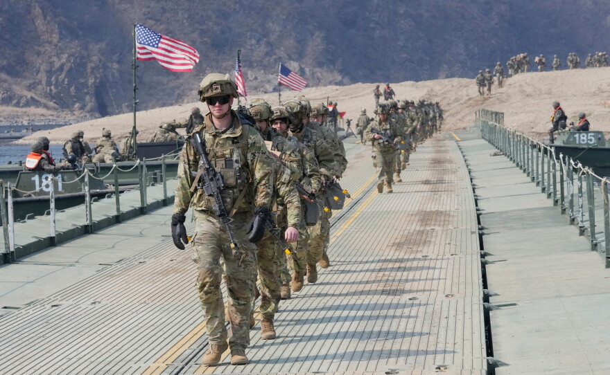 FILE - U.S. Army soldiers cross a floating bridge on the Imjin River during a joint river-crossing exercise between South Korea and the United States as a part of the Freedom Shield military exercise in Yeoncheon, South Korea, March 20, 2025.