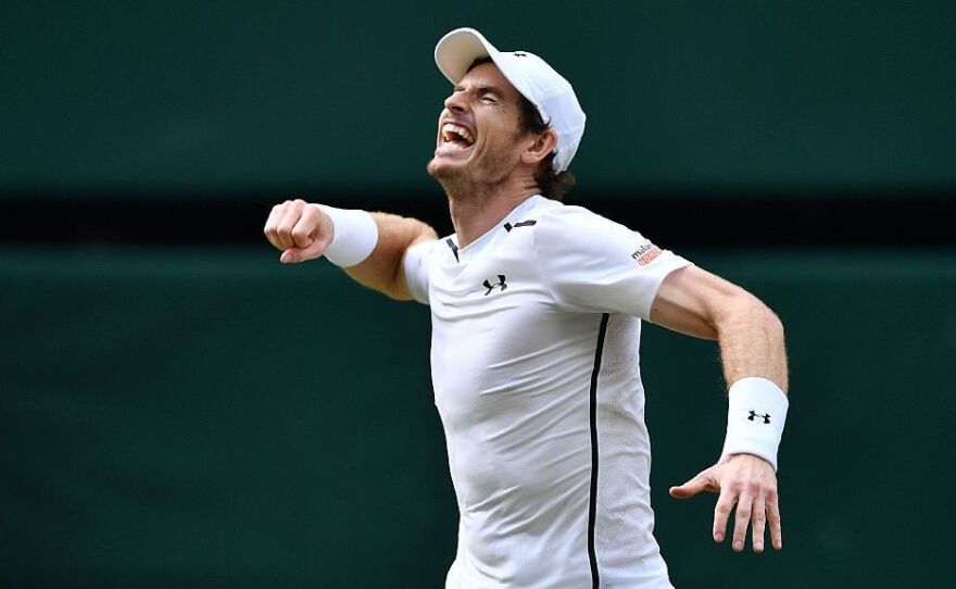 Britain's Andy Murray celebrates beating Canada's Milos Raonic during the men's singles final match on the last day of the 2016 Wimbledon Championships in Wimbledon, southwest London, on Sunday.