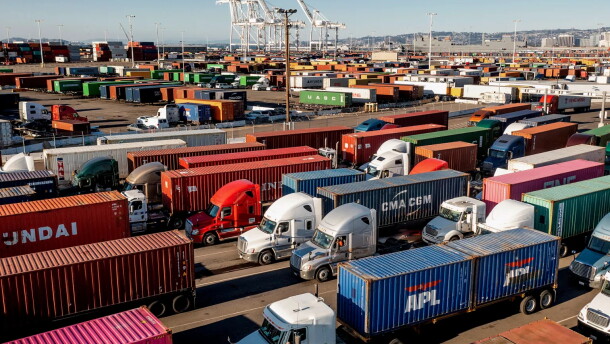 Trucks line up to enter a Port of Oakland shipping terminal in Oakland on Nov. 10, 2021.