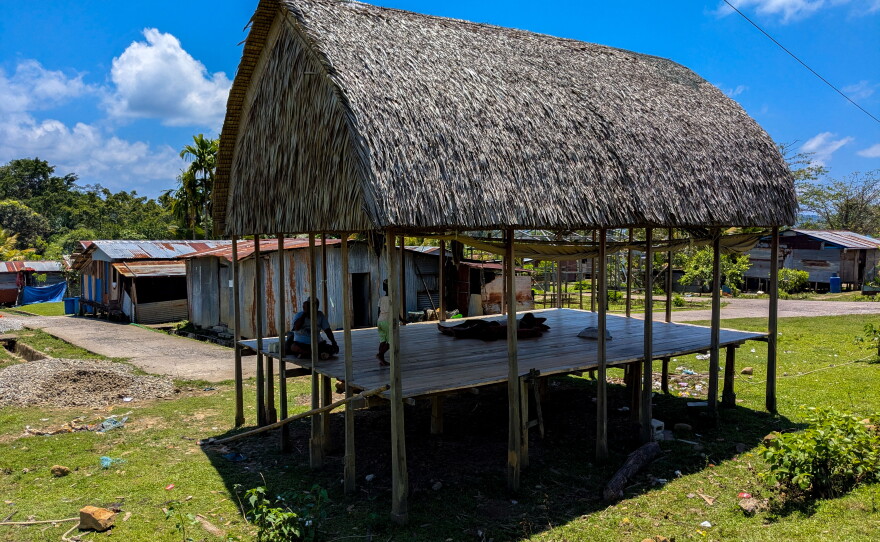 Before the 2004 tsunami destroyed their villages, the indigenous Nicobarese lived in thatched-roof shelters like these, which have been erected in a relief camp near the coast.