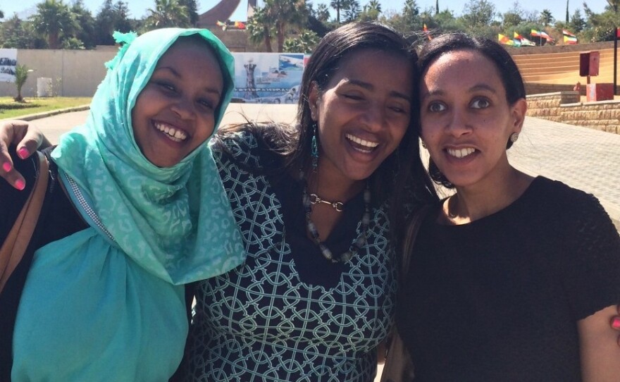 Haben Girma (right) and friends at the Martyrs Memorial in Mekele, Ethiopia, honoring those who died in the country's civil war.