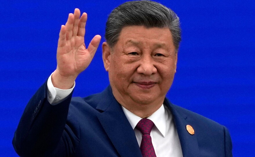 Chinese President Xi Jinping waves as he arrives at the opening ceremony for the World AI Conference in Shanghai, Friday, July 17, 2026.