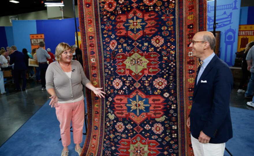 Michael B. Grogan appraises a Karabagh corridor carpet, ca. 1900, for $4,000 to $6,000 in Knoxville, Tennessee.