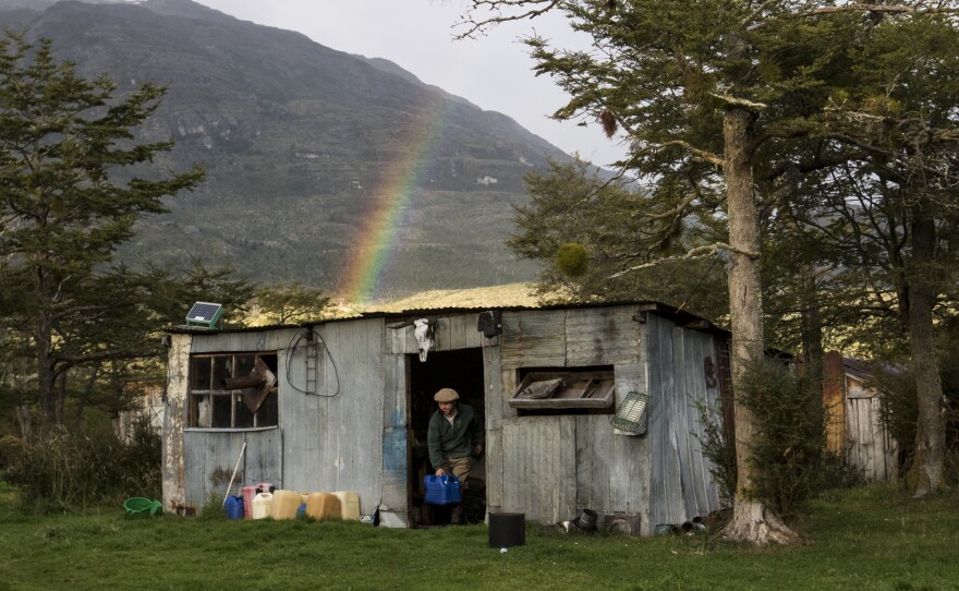 On day 16 on the ranch without going to town, Hautamaki's partner, Juan Luis, places an empty fuel canister outside a shed after refilling the diesel generator. The generator, used sparingly at night, provides electricity to the ranch.