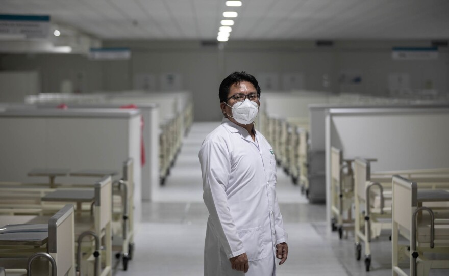Dr. Juan Carlos Celis Salinas inside a now empty COVID ward at the Iquitos Regional Hospital. In the early days of the pandemic, he says, that hospital was on the verge of collapse. Hallways were filled with patients on cots.