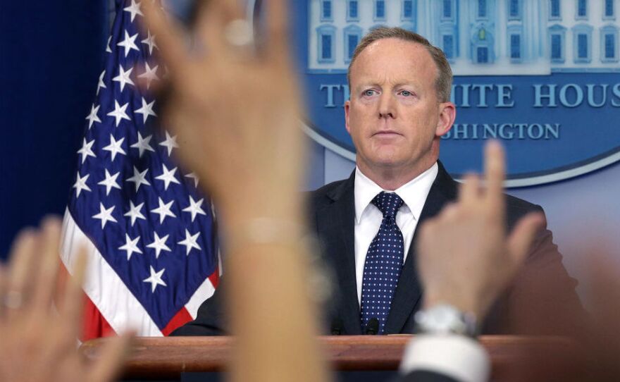 White House press secretary Sean Spicer briefs the media in June. He announced Friday that he was stepping down from his job in the Trump administration and would continue his service through August.