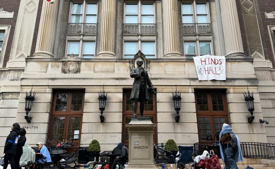 Pro-Palestinian student protesters sit on the front steps of Hamilton Hall at Columbia University in New York City on April 30, the morning after protesters took over the college building.