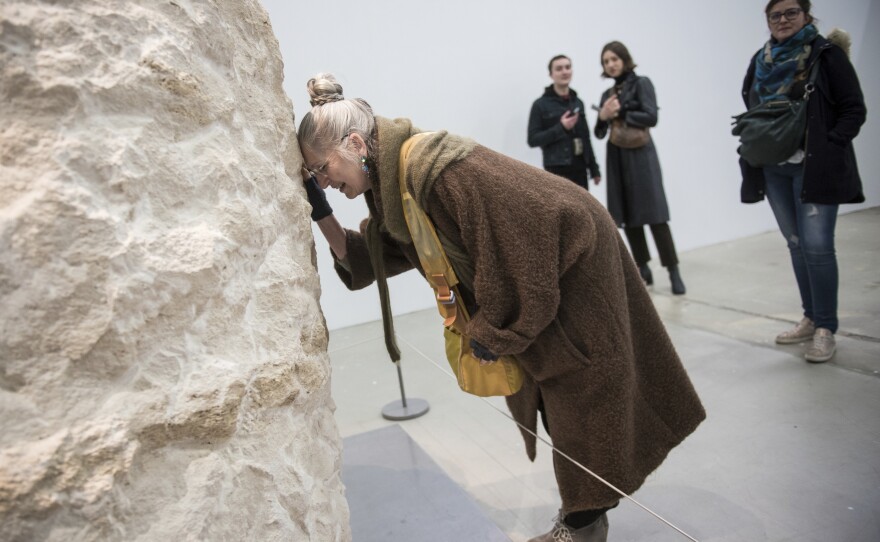 Poincheval had a visit from his mother, Eveline, who talked to her son though the rock while he was inside.