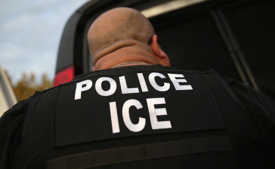 An Immigration and Customs Enforcement agent detains an immigrant in 2015 in Los Angeles. A new round of detentions this week has triggered complaints from immigrant advocates.