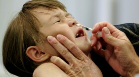 Danielle Holland reacts as she is given the FluMist vaccine in St. Leonard, Md., Oct. 4, 2005.