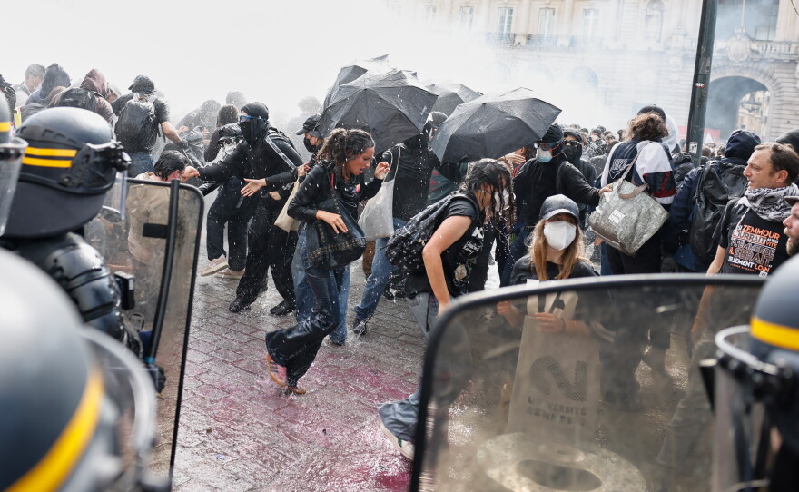 Riot police use a water cannon as they face students during a protest against under-resourced schools, in Rennes, western France, Tuesday.