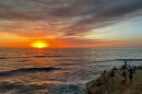 People watch the sunset on Sept. 5, 2024 at Sunset Cliffs in San Diego, Calif.