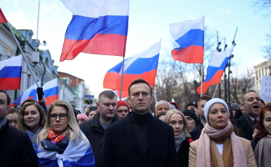 Alexei Navalny, his wife Yulia, opposition politician Lyubov Sobol and other demonstrators march in memory of murdered Kremlin critic Boris Nemtsov in downtown Moscow in February 2020.