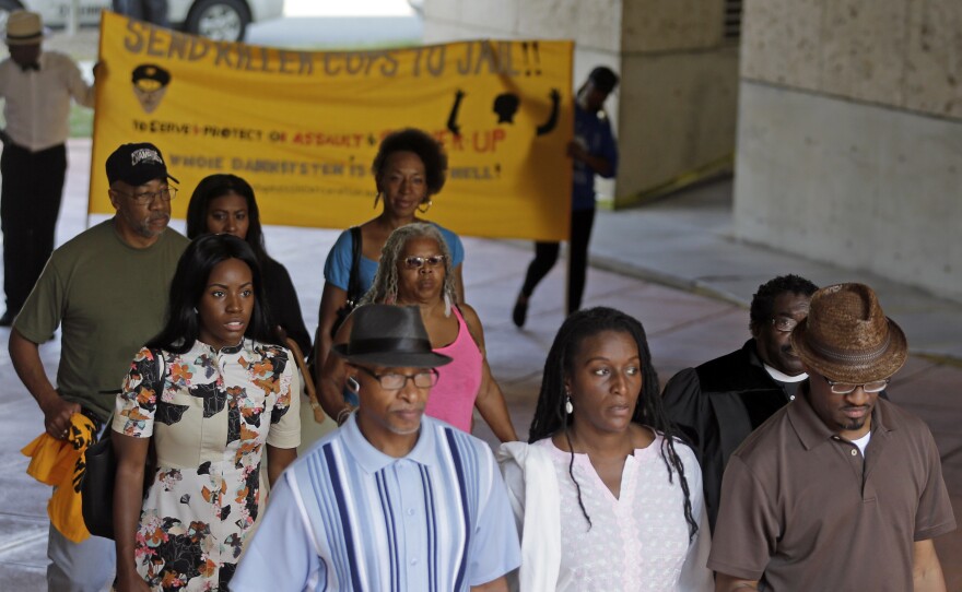 Protesters arrive at the Mecklenburg County Courthouse on the first day of the trial of former Charlotte-Mecklenburg police Officer Randall Kerrick in Charlotte. Kerrick is charged with manslaughter in the shooting death of Jonathan Ferrell.