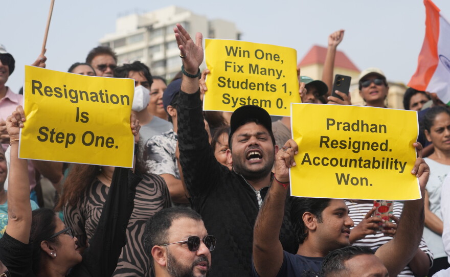 Protesters react after India's Education Minister Dharmendra Pradhan resigned following nationwide protests as part of the Cockroach Janta Party's protest movement in Mumbai, India on Saturday.
