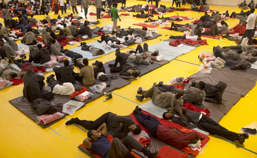 African migrants rest inside a sport center on Wednesday in Tarifa, Spain. Temporary shelters for the migrants are packed beyond capacity.