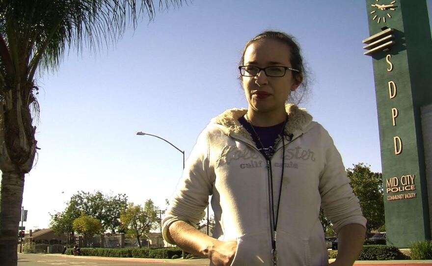 United Against Police Terror - San Diego organizer Cathy Mendonca stands in front of the Mid-City Police Substation on Fairmount Avenue on Nov. 25, 2014.