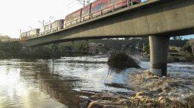 Flooding under a trolley bridge in Mission Valley following heavy rain, Feb. 28, 2017. 
